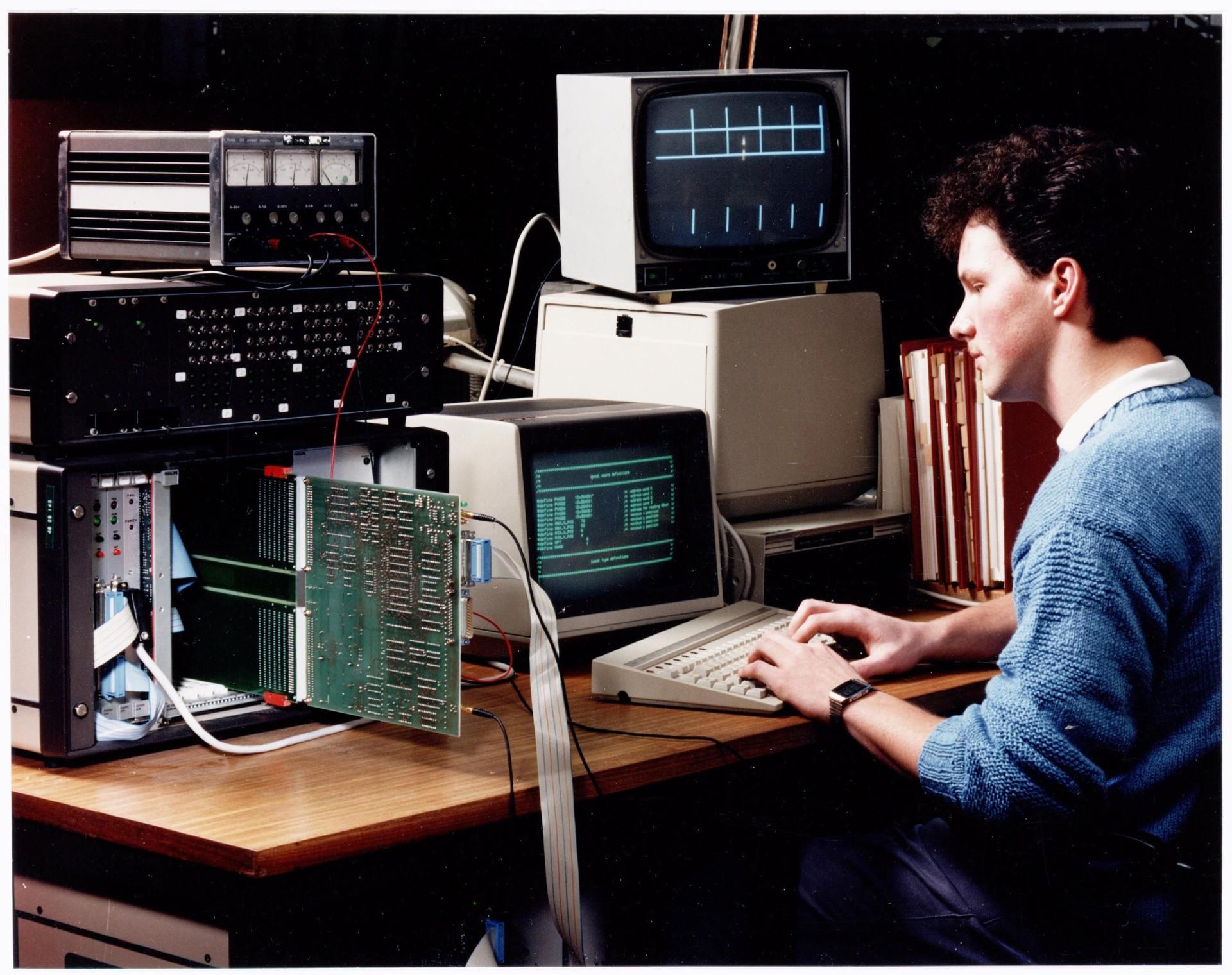 Arcade development laboratory with cathode-ray test benches and 68000 systems.